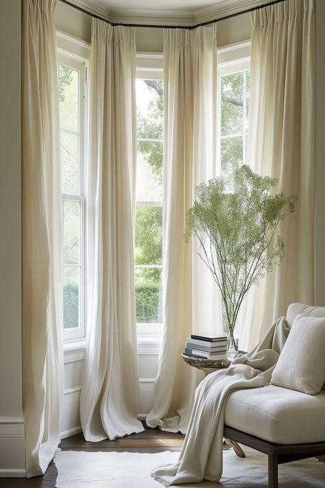 Serene bay window setting with flowing sheer linen curtains, bringing a calm and elegant feel to the room. Curtains For Living Room Windows, Window Treatments For Bay Windows, Bay Window In Living Room, Curtains Bay Window, Bedroom Bay Window Ideas, Bedroom With Bay Window, Bay Window Dressing, Bay Window Decorating Ideas, Victorian Bay Window