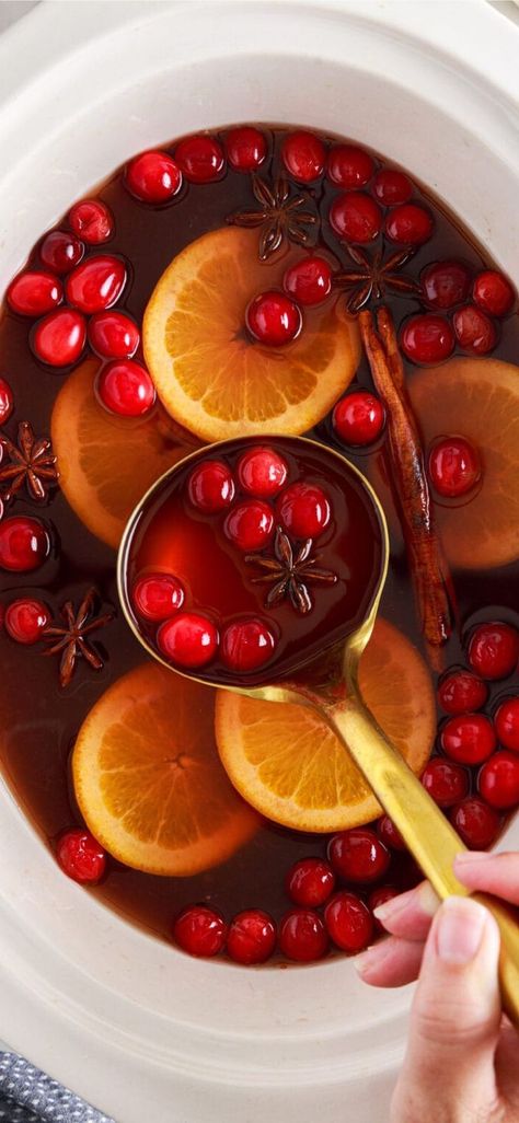 This crockpot hot cranberry punch is slightly sweet but balanced well with the anise and cinnamon sticks, filling your room with its warmly spiced aroma. #aamandascookin #cranberrypunch #holidaydrinks