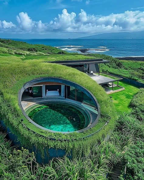 Jima House represents a paradigm shift in contemporary architectural discourse, marrying advanced design principles with a profound respect for the natural environment. Situated atop the rugged cliffs of Iwo Jima, this conceptual residence embodies the ethos of organic architecture, redefining spatial relationships and materiality. #architecture #house #interiordesigner #decor #diy #homedecor #amazingarchitecture #interiordesign #contemporaryhome #modern #residence #designer #home #garden Organic Modern Architecture, Modern House In Nature, Materiality Architecture, Eco Friendly House Architecture, Solarpunk Architecture, Iceland Architecture, Organic House Design, Sustainable Design Architecture, Architecture In Japan