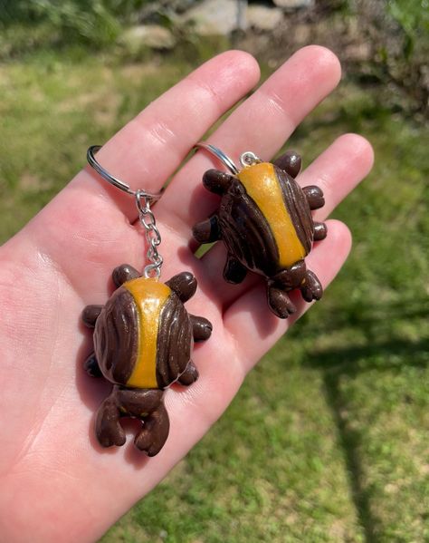 These chocolate beetles are a delicious snack of Coraline's Other Mother! Enjoy them now on your keychain!  - These are handmade, hand-painted, and packaged by me, so their appearance may vary! That just makes them more unique for you! I make my products from polymer clay, the time it takes to make each item is approximately 1-3 days.                             -- Delivery -- 📦  I ship packages throughout the week when I find the time.  - USPS: tracked package!  - I am not responsible for orders after they've been mailed out  - Delivery times may be delayed for a number of reasons, your patience is very much appreciated.  ♻️  My packaging may include some recycled materials. Clay Art Halloween, Coraline Beetle, Coraline Pottery, Coraline's Other Mother, Coraline Clay, Clay Beetle, Coraline Crafts, Coraline Stuff, Polymer Clay Figurine