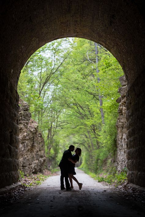 Get ready for some serious lovey-dovey cuteness! We took this engagement session to the next level of fun on the enchanting MKT trail in Rocheport, MO. From blooming wildflowers to the mysterious train tunnel and abandoned duck blind, we couldn't resist capturing every moment of these lovebirds' playful journey through this oh-so-picturesque trail. Couples Homecoming Pictures, Pop Wedding, Train Tunnel, Duck Blind, Homecoming Pictures, Photoshoot Outdoor, Pre Wedding Photoshoot Outdoor, Couple Picture, Couple Picture Poses