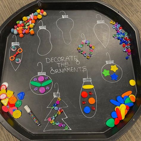 Scholar's Choice on Instagram: "Decorate the Ornaments 🎄 Can you create unique ornaments with the loose parts? 🌈 This is a fun and easy holiday activity that allows children to express their creativity! On your tuff tray take a chalk marker and draw different ornaments of all designs, shapes and sizes! Place different loose parts around your ornaments and then invite children to create and design their own ✨ Ways to extend the play: -Can you make an ornament with a certain amount of loose pa Oshc Christmas Activities, Easy Maths Activities, Fun Fair Activities, Reggio Holiday Activities, First Day Of School Tuff Tray Ideas, Eyfs Outside Provision, Jelly Tuff Tray Ideas, Easy Tuff Tray Ideas Toddlers, Christmas Children Activities