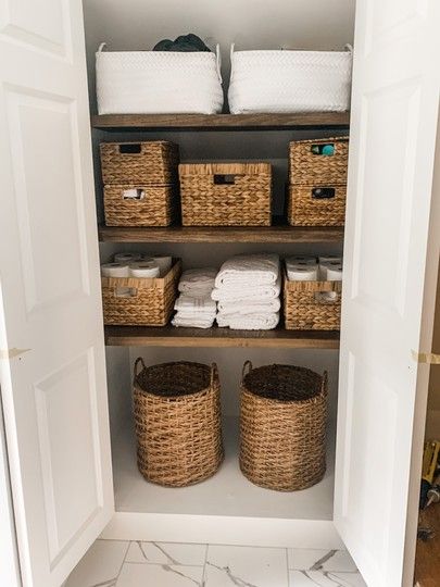 Bathroom closet renovation: natural wicker storage baskets with lids(linked almost identical ones), wicker baskets with handles, white plush textured towels, white hand towels, white washcloths, round wicker basket with handles for hampers, large  white woven basket with handles #bathroomrenovation #linencloset #bathroomdecor #wickerbaskets Woven Basket Bathroom Storage, Bathroom Closet With Hamper, Wicker Basket Towel Storage, Bathroom Decor Baskets, Bathrooms With Baskets, Round Wicker Baskets, Bathroom Wicker Basket, Bathroom Basket Organization, Linen Basket Storage