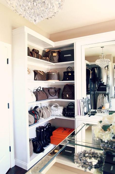 Designer bags sit against a beige wall atop built in white wrap around shelves positioned beside a dresser vanity accented with a mirror illuminated by a crystal chandelier. Toddler Closet Organization, Shoes Organizer Ideas, Organization Shoes, Make Up Tisch, Shoe Station, Toddler Closet, Trendy Closet, Ikea Regal, Master Closet Organization