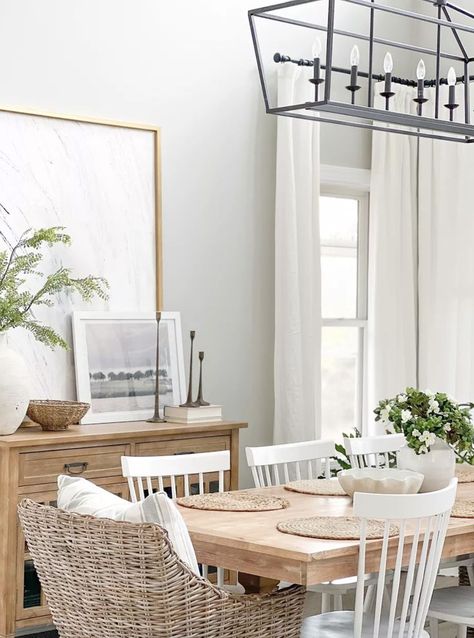 Dining room decor - coastal home - coastal style room - dining room inspo - dining furniture - rattan furniture - coastal home decor, coastal home inspiration, coastal dining room design, coastal dining room inspo, coastal home ideas, beach house decor, lake house decor, coastal vibes, coastal furniture, beach house furniture, white dining room chairs, wood dining table, coastal farmhouse dining room inspiration ideas Dining Room With Wicker Chairs, Dining Table Coastal Style, Coastal Kitchen And Dining Room, Coastal Living Dining Room Combo, Coastal Rectangular Dining Table, Dining Room Table With White Chairs, White Kitchen Dining Table Ideas, Mid Century Coastal Dining Room, White Coastal Furniture