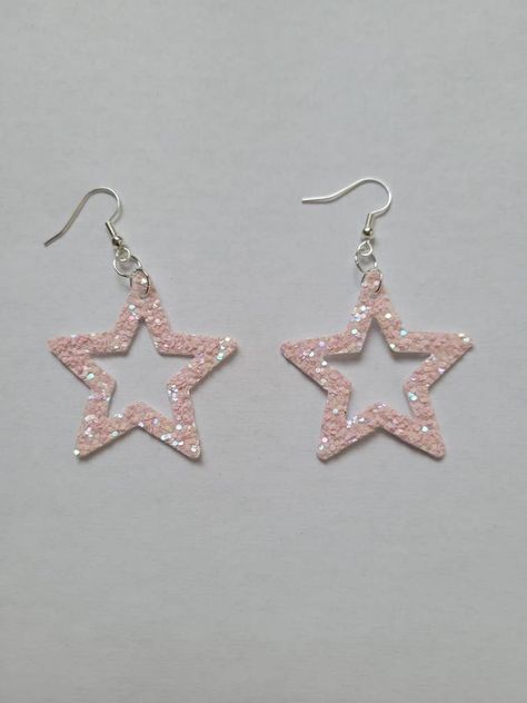 A little fairy came and dusted these with her glittery fairy dust and left them to be admired by all! Featuring a pearlescent shine in the sun, they are perfectly dainty and so beautiful. Glittery Earrings, Glitter Stars, Fairy Dust, Star Earrings, Pink Glitter, Etsy Earrings, The Sun, Dangle Drop Earrings, Glitter