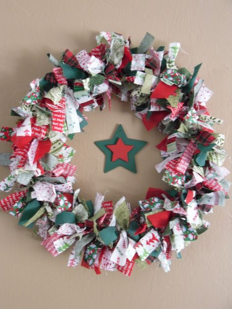 I made this primitive christmas wreath with a wire clothes hanger and scraps of fabric~Painted the star and attached them with fishing wire Christmas Fabric Crafts, Christmas Decorations Wreaths, Fabric Wreath, Rag Wreath, Christmas On A Budget, Xmas Wreaths, Handmade Christmas Decorations, Christmas Sewing, Noel Christmas