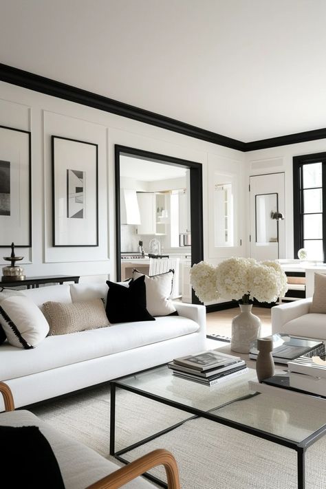 13 Chic Room Ideas Featuring White Walls With Black Trim Black And White Living Room With Fireplace, Black White Sitting Room, White House With Black Trim Interior, Black White Living Room With Color, Black White Modern House, Dark Floor White Walls Living Room, Cream And Black Lounge, Black And White Family Room Ideas, Black And White Paneling