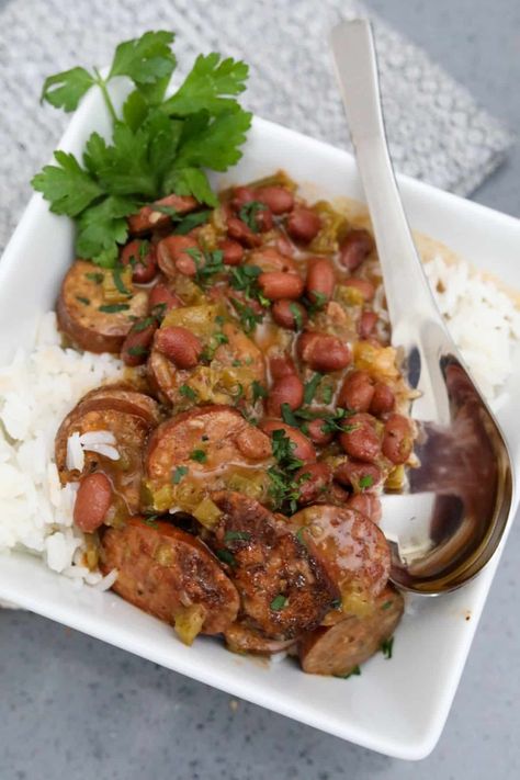 Red beans and rice is the definition of comfort food. It is made with small red beans and andouille sausage. This Southern staple is a perfect side or meal. Beans Rice And Sausage, Rice With Sausage, Dinner Hosting, Small Red Beans, Red Beans Rice, Red Beans And Rice, Southern Dishes, Southern Cuisine, Beans And Rice