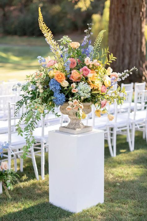 Colorful Aisle Flower Arrangement with Vase on Pedestal Pedestal Flower Arrangements, Diy Pedestal, Urn Arrangements, Colorful Wedding Flowers, Aisle Flowers, Church Flowers, Wedding Ceremony Flowers, Wedding Vases, Ceremony Flowers