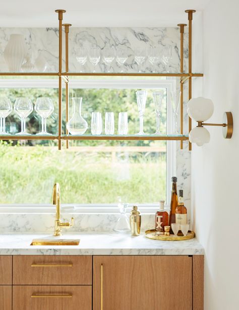 Bring the outside in with Amuneal's wall and ceiling mounted Collector's Shelving Units by placing them in front of windows! Featuring brass and glass shelves, this piece is perfect for functional and aesthetic storage + display. #kitchenideas #homedecorideas #brass #shelving Glass Bar Shelves, Bistro Shelving, Brass Shelving, Glass Shelves Kitchen, Ceiling Shelves, Open Ceiling, Diy Hanging Shelves, Bar Shelves, Window Shelves