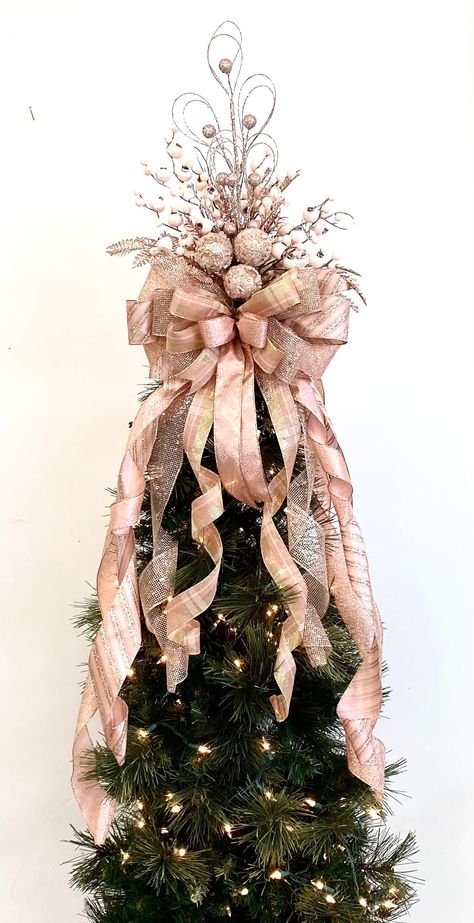 "Top your tree with this Pink Christmas design. Rose gold, dusty pink, mauve, glitter stripe colors. Ribbons  measure 2.5\" wide mixed with matching 1.5\" wide with wired edges for easy fluffing. The ends of tail streamers are straight for easy curling. Snow covered pink berries, iced ornaments in center. Glitter branches look great at night too.  This Pink Christmas design looks great on real or artificial trees, use on a large wreath, staircase, swags. It is handmade. Measures  14\" wide x 16\" long plus 10 tail/streamers that vary in length to 36\". This is a one sided design and flat on back. If you need it to look good all around your tree- Buy 2." Rose Gold And Leopard Christmas Tree, Pink Black Silver Christmas Tree, Pink Christmas Tree Topper, Christmas Tree Ideas 2023 Trends Pink, Rose Gold And Burgundy Christmas Tree, Pink And Champagne Christmas Tree, Blush Pink Christmas Tree, Barbie Tree, Christmas Tree Roses