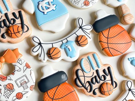 Ashley on Instagram: “A baby shower set fit for Tar Heels fans! UNC blue mixed with orange made for a fun color palette and I used a random illustration from one…” Basketball Theme Baby Shower, Random Illustration, Fun Color Palette, Jordan Baby Shower, Basketball Baby Shower, Sports Baby Shower Theme, Sports Baby Shower, Basketball Baby, Cheap Baby Shower