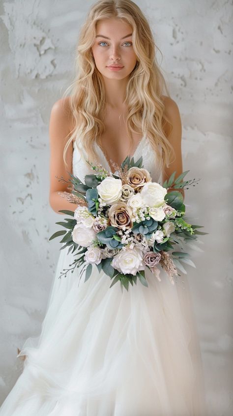 More beautiful wedding flowers https://bridalstoryus.etsy.com  Bridal wedding bouquet is created with high quality silk flowers. These handmade artificial wedding bouquets make beautiful additions to wedding and event floral arrangements. Flowers: peonies, roses, eucalyptus and fillers.  Colors: white, beige, taupe, green, white, pale champagne. Handle: wrapped in ivory satin ribbon. Size: bridal bouquet is approximately 14" wide, bridesmaids bouquet is 8". SUGGESTION: steaming the bouquets upon Tiana Wedding, Wedding Bouquet White, Bridal Bouquet White, Brides Flowers Bouquet, Vintage Bridal Bouquet, Eucalyptus Wedding Bouquet, Rust Wedding, Elegant Wedding Bouquets, Bridal Bouquet Summer