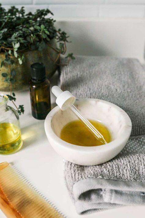 Get the recipe for a healthy scalp oil recipe loaded with essential oils and herbs and learn how to give yourself a soothing scalp massage.