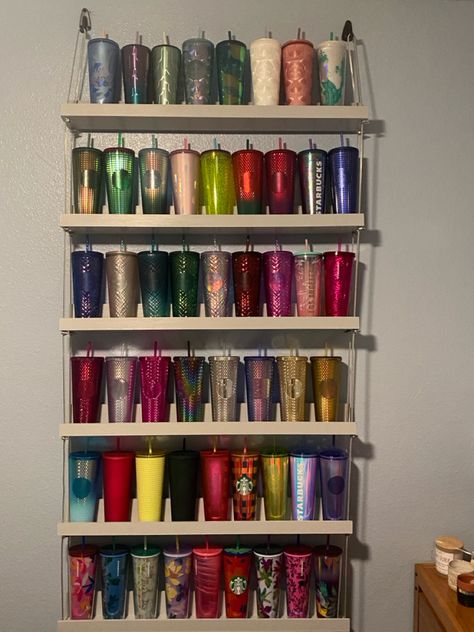 Shelves are hung with coated cable Tumblr Cup Storage Ideas, Tumbler Shelf Display, Stanley Cup Organization, Starbux Cups, Starbucks Tumbler Collection Display, Cup Collection Display, Starbucks Cups Display, Tumbler Storage Ideas, Tumbler Display Ideas