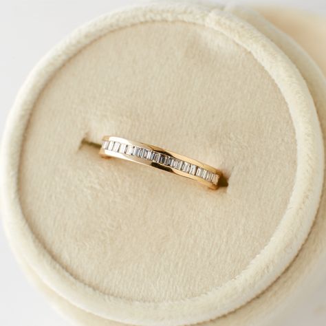 Made for the traditionalists, the Ari band is a classic channel-setting design that compliments a variety of engagement and just-because rings. Set with 22 baguette diamonds around the band, this half-eternity ring adds incredible sparkle to any stack. DETAILS: Set with approximately 0.44 carats of natural white diamonds with clarity SI1 or better and color H or better; total carat weight of approximately .32 carats. Band width of 3mm Made of 14 karat solid gold Please allow 4 weeks for your rin 3 Stack Engagement Ring, 1 Karat Wedding Ring, Gold Band With Emerald Diamond, Wedding Ring Stack Small Diamond, Artist Engagement Rings, Pearl Engagement Band, Women's Wedding Bands, Simple Engagement Bands For Women, Wedding Band Gold Women