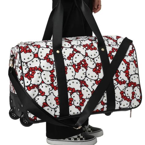 Hello Kitty All Over Print Rolling Duffle Bag Elevate Your Travel Game Thanks To This Hello Kitty Rolling Duffle Bag. The Spacious Main Compartment Ensures You Have Ample Room To Pack Your Belongings And Essentials, Whether You're Headed On A Vacation Or To The Gym. With Two Wheels And An Adjustable Shoulder Strap, You Have A Versatile Choice For Any Adventure You Embark On. Hello Kitty Fans, Get Ready To Travel In Style And Cuteness! All-Over Print Artwork Lightweight Poly Material Adjustable + Hello Kitty Travel, Disney Luggage, Rolling Duffle Bag, Hello Kitty Bags, Friends Fan, Friends Merchandise, 17 Inch Wheels, Hello Kitty Friends, Hello Kitty Bag