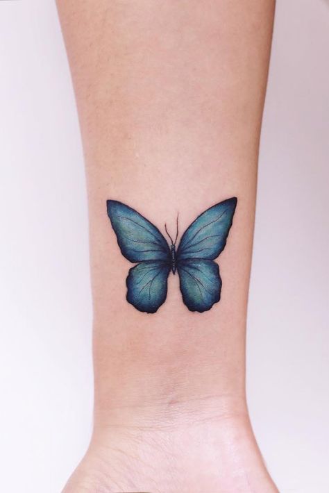 Blue Butterfly Tattoo On Arm #bluebutterflytattoo #bluebutterfly Meaningful Butterfly Tattoo, Butterfly Tattoo On Arm, Tiny Butterfly Tattoo, Butterfly Tattoos Images, Butterfly Tattoos On Arm, Blue Butterfly Tattoo, Tattoo Guide, Butterfly Tattoo On Shoulder, Tattoo On Arm