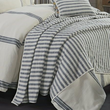 Step into the past with our quilted Market Place Blue Collection, offering timeless charm for your bedroom decor. Featuring grain sack fabrics and denim blue ticking stripes, our quilts and accents add a touch of vintage farmhouse nostalgia to any space. This Piper Classics collection offers coordinating pattern options to effortlessly fashion your space with warmth and style. Crafted with meticulous detail, our Market Place Blue Ticking Stripe Oversize King Quilt ensures enduring quality and easy care. Elevate your rustic decor with the Market Place Blue quilt, boasting hand-quilting and machine-stitching for durability and a retro look. Rediscover the warmth of days gone by with Piper Classics' vintage-inspired bedding and accessories, perfect for creating a cozy retreat in your home. Fr Blue Ticking Stripe Bedding, Grey Striped Bedding Ideas, Red White And Blue Nautical Decor, Blue Plaid Bedroom, Striped Bedding Ideas, Blue And White Bedroom Master, Nautical Theme Bedroom, Navy And White Bedroom, Denim Bedding