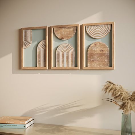 Elevate your living space with these picture frame style wall art pieces that flawlessly blend boho chic with rustic elements. A set of three, each frame showcases a calming light green background, contrasted by a wooden abstract arch. The distressed white lines on the arch add a layer of depth and intrigue to the design. The distressed finish on the frames infuses a vintage touch, making each piece tell a story of its own. This modern contemporary wall art also acts as an interesting topic of Bedroom Boho Wall Decor, Bohemian Wood Decor, Lightweight Wall Decor, Above Bed Boho Decor, Boho Modern Wall Decor, Cheap Boho Decor Ideas, Cabin Bedrooms, Boho Chic Wall Decor, Old Wooden Ladders