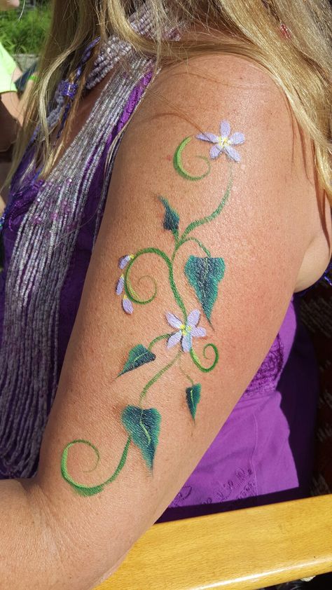 Vines face body art Fairy Body Painting, Fairy Body Art, Forest Fairy Face Paint, Vine Face Paint, Leaves Face Paint, Hozier Concert, Spring Costume, Fairy Face Paint, Festival Face Paint