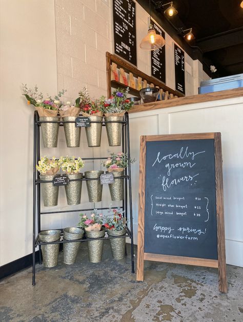 local flower stand in coffee shop. Coffee House Signage, Flower Shop Stand Ideas, Small Floral Shop Ideas, Flower Bakery Shop, Flower Display Retail, Coffee Bag Storage, Floral Cafe Coffee Shop, Flower Shop Cafe Aesthetic, Farm Shop Decor Ideas