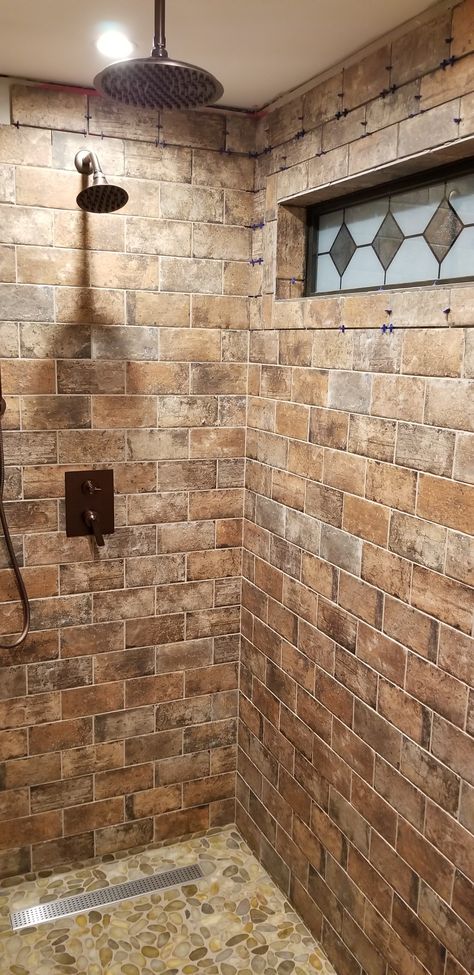 Brick look tile with stone floor and rain shower.. Brick In Shower Walk In, Brick Look Shower Tile, Brick Tile Shower Ideas, Brick Shower Ideas, Natural Stone Shower Ideas, Brick Shower Tile, Brick Shower Wall, Brick Tile Shower, Stone Shower Ideas