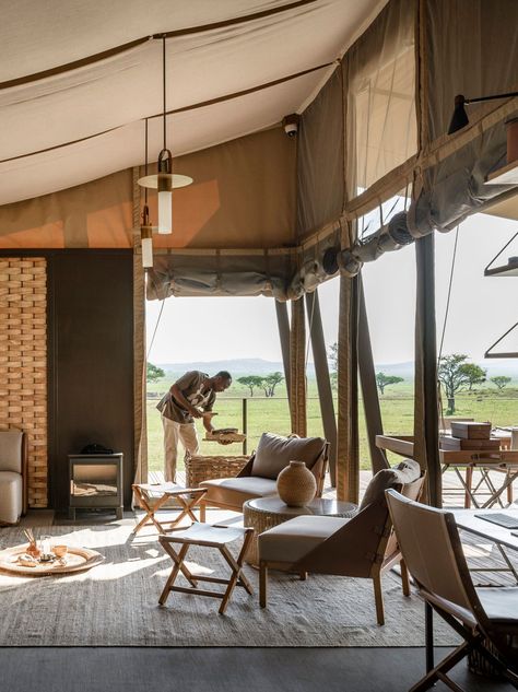 Singita Sabora Tented Camp has all the ingredients of an authentic safari, in which the old-world elegance meets contemporary luxury. The place wows with the level of service, the luxury and opulence of its tents, and the exclusivity of its own private reserve. #tanzaniasafarilodges #besthotelsintanzania #africaluxurytravel #AfricaLodgeLuxury #luxurysafarilodge #africaluxurysafari #africahoneymoon #bestsafarilodges #luxuryglamping #serengetinationalparklodges #serengetisafarilodge Singita Sabora Tented Camp, Safari Tent Interior, Luxury Safari Tent, Singita Lodge, Luxury Lodge Interiors, Safari Tent Decor, Safari Lodge Interior, Refreshment Station, Glamping Business