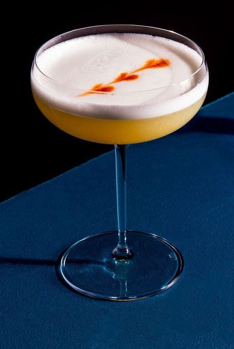 The Artesano Pisco Sour is a foamy, pleasantly earthy cocktail that calls for pisco, lime juice, an egg white, and gum syrup. Garnish your Artesano Pisco Sour with a few drops of bitters. Grape Brandy, Peruvian Cuisine, Food Photoshoot, Good Introduction, Pisco Sour, Sour Cocktail, Whiskey Sour, Easy Cocktails, Gin Tonic