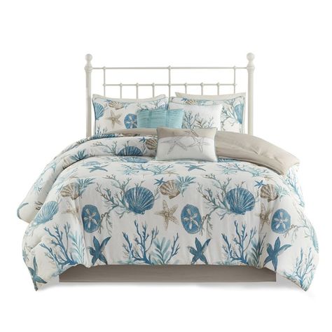 Elevate your bedroom with the Coastal Oasis 7-Piece Cotton Sateen Comforter Set designed for a vibrant coastal update to your space. This set features an all-over print of shells starfish and coral in aqua teal and taupe colors to brighten your room. The soft cotton/polyester reverse in solid taupe complements the coastal design while the matching shams beautifully coordinate with the comforter to complete the coastal look. Additionally three decorative pillows with coastal embroidery details add dimension to the top of the bed while a solid bed skirt adds the finishing touch. The polyester filling in the comforter and decorative pillows are treated to be and contain no . certified this cotton comforter set ensures quality comfort and wellness. The set is machine washable for easy care and Coastal Bed, Solid Bed, Cotton Comforter Set, Floral Comforter Sets, Bed Comforter Sets, Comforter Bedding Sets, King Comforter Sets, Bed In A Bag, Cotton Comforters