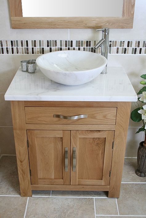 Delivery: 2-3 Working Days Next Day Delivery : Upgrade available upon checkout. This unit comes complete with: A beautiful marble bowl set. A stunning pre drilled white veined marble top. Bowl dimensions : H14cm X Diameter 43cm. This complete bathroom vanity unit has … Continue reading → Floor Cabinets, Bathroom Sink Units, Veined Marble, Oak Bathroom Vanity, Bathroom Vanity Unit, Bathroom Sink Taps, Oak Bathroom, Marble Bowl, Complete Bathrooms