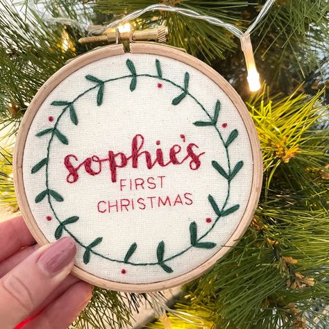 Hand embroidery hoop with Sophie’s First Christmas hand stitched. Personalised newborn baby gift and Christmas decorations First Christmas Embroidery, Diy Overalls, Holiday Embroidery Patterns, Baby Christmas Decorations, My First Christmas Outfit, Christmas Hand Embroidery, Autumn Embroidery, Embroidery Ornaments, Babys First Christmas