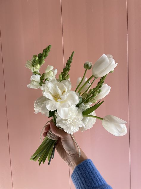 #white #bridal #bouquet #wedding #flowers #tulips #snapdragons #carnations White Tulips Bridesmaid Bouquet, Bouquet Tulips Wedding, Tulips Bridesmaid Bouquets, White Carnations And Eucalyptus, Unique White Wedding Bouquet, Mini Bridesmaid Bouquet White, Bridal Tulip Bouquet, Tulip Wedding Florals, Wedding Flowers Tulips Bouquet