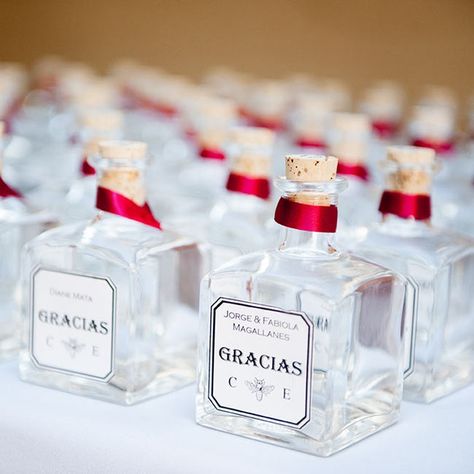 Cristina and Eli sent their guests home with personalized bottles of silver tequila. Tequila Shot Seating Chart, Mini Tequila Bottles, Mini Tequila Bottles Favors, Small Tequila Bottles Wedding Favors, Alcohol Wedding Favors Zazzle, Cinderella Quinceanera Themes, Old New Borrowed Blue, Spanish Style Wedding, Tequila Bottles