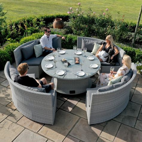 This large set is a great style for entertaining in your garden home, the set tucks away into a circular shape when not in use and then expands out into a perfect dining experience for your friends and family. The curved sofa design means you can sit round the rising table and dine in luxury with your guests. The lock in and lock out rising table is a simple mechanism to transform your table from coffee to dining. An additional feature is the lazy susan, entertain your guests with snacks and alf Large Round Table, Rattan Dining Table, Sofa Dining, Dining Roo, Round Sofa, Rattan Garden Furniture, Bench Set, Grey Gardens, Design Outdoor