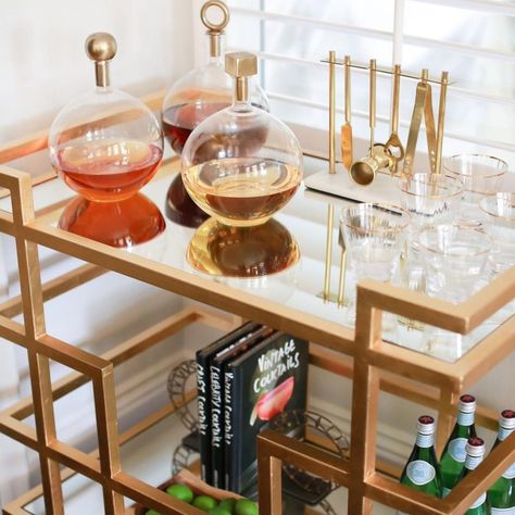 15 brilliant bar cart styling tricks Decanter Display Bar Cart, Bar Cart Display Ideas, 21st Birthday Bar Cart, Bar Tools Display Ideas, Bar Cart Inspo Modern, Bartesian Cocktail Maker Bar Cart, Home Bar Styling, Decorating A Bar Cart, Decanter Display Bar