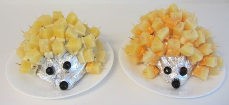 It's a British thing!  Cheese and Pineapple Hedgehogs (or Porcupines).  A cabbage cut in half, wrap in tin foil, add cheese and pineapple chunks on cocktail sticks for spines, olives for eyes and nose.    You can also use a potato for the body.  I used a mild cheese for one and a hot Mexican cheese for the other, fun for parties! Cheese and Pineapple go well together. Cheese And Pineapple Hedgehog, Pineapple Hedgehog, Duggee Party, Cheese And Pineapple, Gruffalo Party, Woodland Fairy Party, Hey Duggee, Bbq Ideas, Mexican Cheese