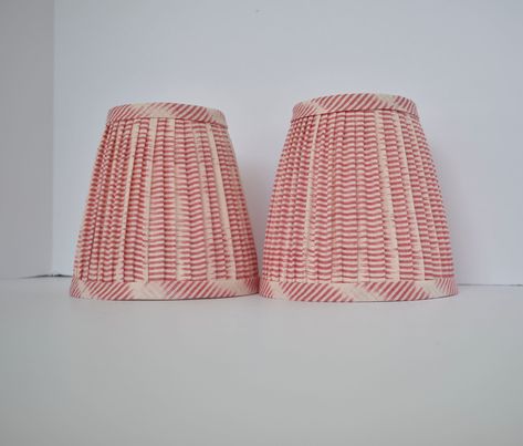 Welcome to ZZ Custom Design!  High quality, beautiful and unique hand  pleated on the top and bottom     gathered  lampshade. Truly elegant and luxurious, made with Cream Pink Ikat Fabric . This listing is for one shade. Lamp Shade Only -Pleated  Gathered shades have a standard, hardback interior.  -Fabric positioning on shades will vary. -Fitting: Regular Round Clip On or Chandelier Clip on  Due to monitor differences, actual colors may vary slightly from what appears online. Please request a free fabric swatch if you're unsure of color                  All my listed lampshades are made with love and care to a professional standard. As a handmade item, every lampshade is different and the pattern might differ slightly from the picture. However, I always select the best pattern placement t Chandelier Shade, Free Fabric Swatches, Fabric Swatch, Chandelier Shades, Ikat Fabric, Free Fabric, Lamp Shades, Fabric Swatches, Lampshades