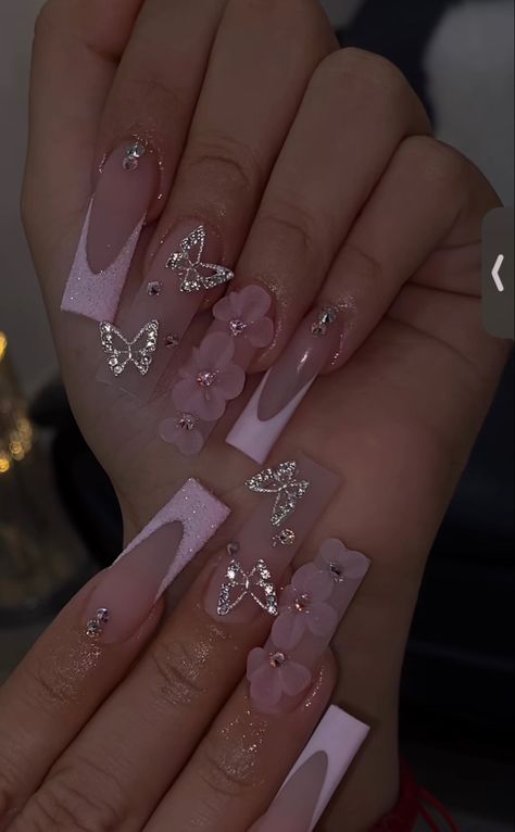 Pink French Tip Nails With Butterflies, Nail Ideas 3d Flowers Pink, 3d Flower And Butterfly Nails, Acrylic Nail Butterfly Designs, Quinceanera Nails Butterfly, Pink French Tip Nails With 3d Flower, Pink Quince Nails With Butterflies, Nail Inspo With Butterflies, Pink Rose Gold Quince Nails