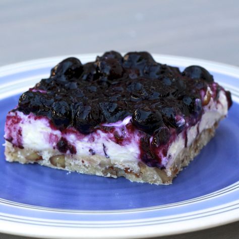 Blueberry Jamboree - shortbread crust, creamy layer, blueberry layer. From Magnolia Bakery. Blueberry Cream Cheese Dessert, Cheesecake With Pecan Crust, Blueberry Jamboree, Strawberry Cream Puffs, Blueberry Yum Yum, Pecan Crust, Blueberry Topping, Cream Cheese Desserts, Magnolias Bakery