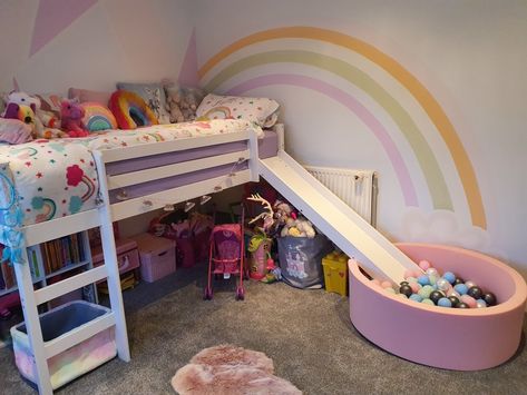 Girls rainbow dream room. Art deco painted wall. Rainbows and unicorns. Mid sleeper bed with slide and ball pit. Bunk Bed With Slide And Ball Pit, Bed With Slide For Girls Fun, Mid Sleeper Girls Room, Mid Sleeper Bed Ideas, Unicorn Bunk Bed, Girls Bedroom Ideas Bunk Beds, Arias Bedroom, Rainbow Bedroom Ideas Kids, Girls Loft Bedroom