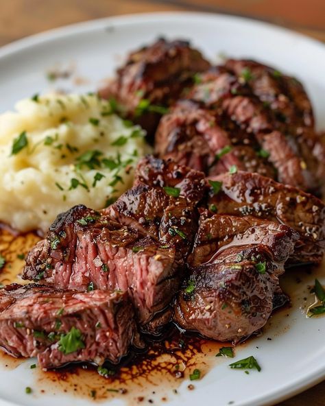 GARLIC BUTTER STEAK BITES AND MASH 🥩 Ingredients: 1 lb sirloin steak, cut into bite-sized pieces Salt and pepper, to taste 4 tbsp unsalted butter 4 cloves garlic, minced 1 tbsp fresh parsley, chopped 2 lbs potatoes, peeled and cubed 1/2 cup milk 1/4 cup sour cream Salt and pepper, to taste Directions: Step 1: Cook the Potatoes Place the peeled and cubed potatoes in a large pot of salted water. Bring to a boil and cook until the potatoes are tender, about 15-20 minutes. Drain and return to ... Steak And Mashed Potatoes Aesthetic, Steak And Mashed Potatoes, Garlic Butter Steak Bites, Butter Steak Bites, Steak And Potatoes, Butter Steak, Sirloin Steak, Garlic Butter Steak, Cubed Potatoes