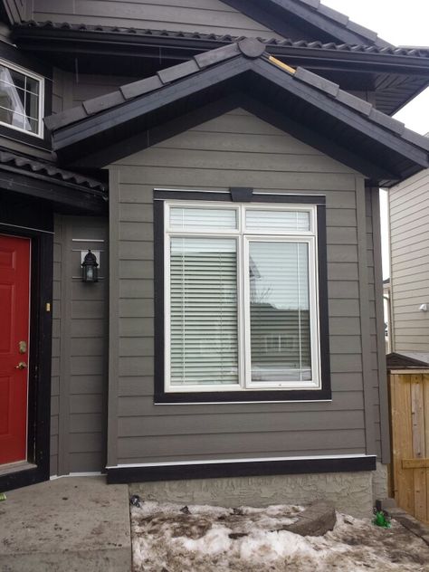 Hardie siding custom painted to Dark Grey with Black trim Black Trim House Exterior, Grey House Black Trim, Grey House, Custom Painted, Black Trim, House Exterior, Dark Grey, Siding, Indonesia