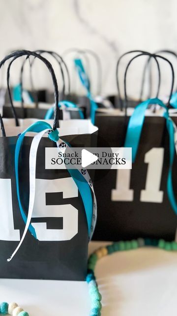 Sierra Miller | Content Creator on Instagram: "I’m on snack mom duty this weekend so you know I had to go all out! ⚽️🙈   I found these bags @hobbylobby and put each team member’s jersey # on the front. I cut the numbers with my @cricut but you could also use stickers for this part if you don’t have a cricut. To bring it all together, I added some coordinating ribbon, which really completed the look! Then, I filled it with some goodies to enjoy after the game. 😍 Being a mom is so much fun..🥹 . . . . . #soccerlife #soccermom #snackmom #soccersnacks #soccersnackideas #kidssoccer #giftideas #soccerparty #soccerpartyideas" Diy Soccer Treat Bags, Senior Night Treat Bags, Football Game Day Goody Bags, Last Soccer Game Treats, Sports Snack Ideas Team Mom, Football Mom Snack Ideas, Soccer Bags For Snacks, Football Team Treats Goodie Bags, Team Mom Soccer