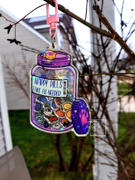 Updated design: now with more cats inside! Showcase your love of cats with this acrylic shaker keychain with holographic stars. This charm stands at 2.5 inches wide and 3 inches tall and is printed on both sides. Inside are various cats and their favorite toys to keep them company.  Each charm comes with a clear protective film to protect it from scratches during shipping. Be sure to peel off the film when you receive your cute keychain.