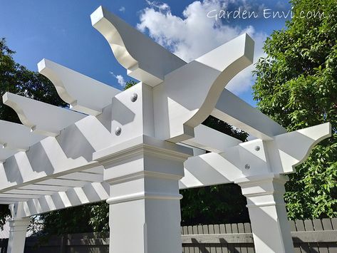 Wow!  This White Pine Hampton's Style Pergola Arbour turned out even better than expected!  It's striking features include a thicker Pine beam and rafter which emanate a commanding presence at the end of the pool.   The large posts with hand made corbels and architrave boxes match the house providing a fluency in design throughout the residence and outdoor structure.   See more pictures and design aspects at gardenenvi.com and make sure you call us to build your next Pergola Arbour! Hamptons Pergola, Pergola With Clear Roof, Roof Home Design, Timber Garden Sheds, Pergola Design Ideas, Deck Shade, Corner Pergola, Pool Inspiration, White Pergola