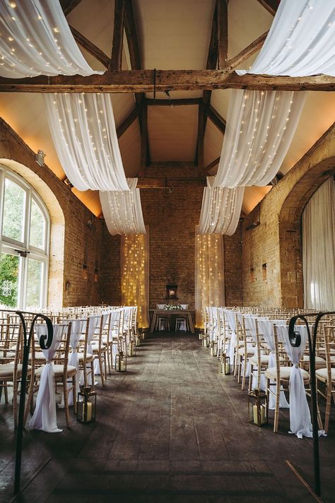 White Gold Wedding Cotswold Pictures Barn Reception Drapes Fairy Lights Decor #wedding #barnwedding Ceiling Drapery With Fairy Lights, Wedding Ceiling Draping With Lights, Fairy Lights Decor Wedding, Ceiling Design Wedding, Lights Decor Wedding, White Drapes Wedding, Tent Ceiling, Wedding November, White Barn Wedding