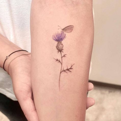 Fine line thistle flower tattoo on the inner forearm. Thistle Ankle Tattoo, Fineline Thistle Tattoo, Thistle And Lavender Tattoo, Delicate Thistle Tattoo, Scotland Thistle Tattoo, Scottish Thistle Tattoo Simple, Scottish Thistle Tattoo Delicate, Fine Line Thistle Tattoo, Scottish Tattoos For Women