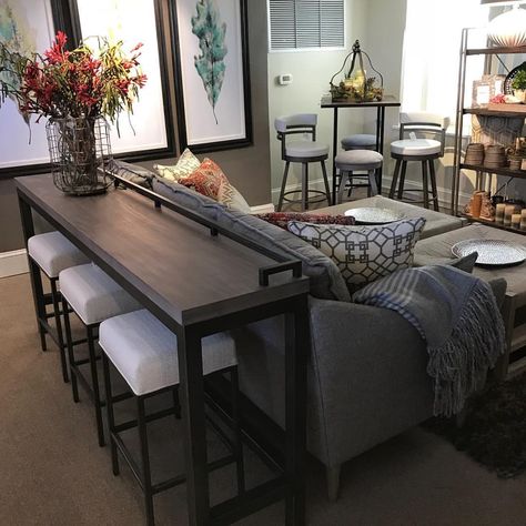 This console table with stools marries the art of accessibility with the charm of rustic design, creating a multi-piece furnishing that is… Console Table With Stools, Decor Behind Couch, Sofa Table Decor, Table Behind Couch, Behind Couch, Gorgeous Sofas, Couch Table, Couches Living Room, A Living Room